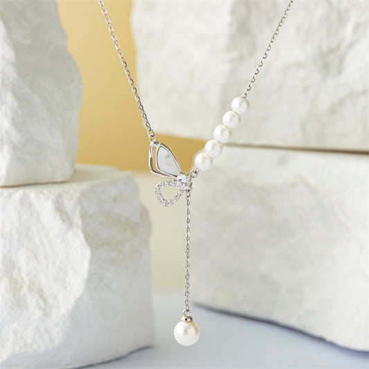 Marquise Perle: Sterling Silver Pearl Bow Necklace